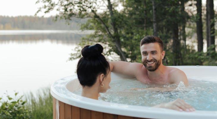 man and woman in hot tub 8845113 730x400